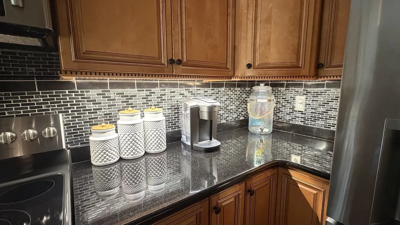 Under-cabinet lighting above a stove area, a real Freedom Electric job